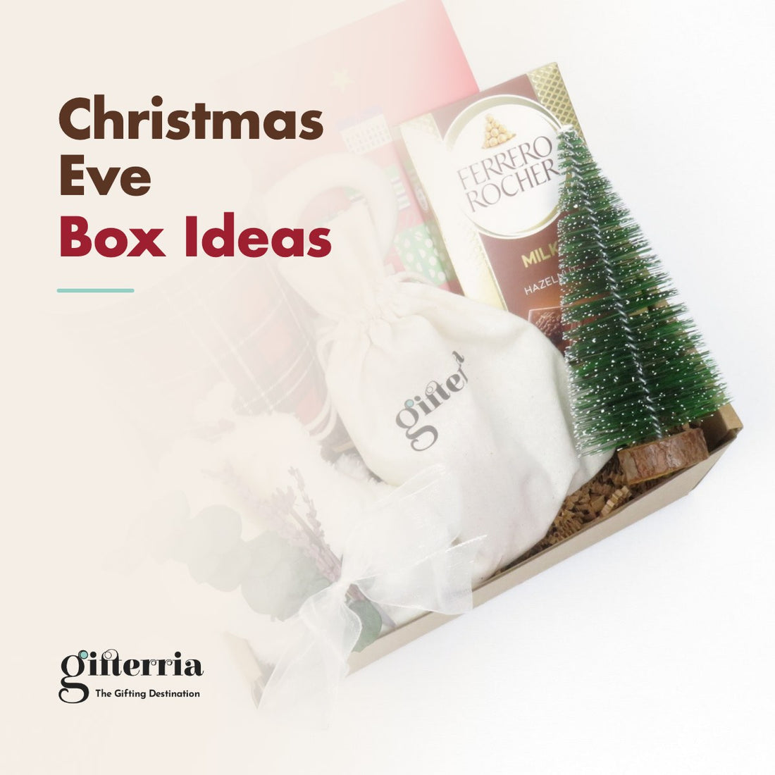 Christmas Eve box with a plaid mug, a Ferrero Rocher bar, a mini Christmas tree and a cotton pouch of cocoa or coffee