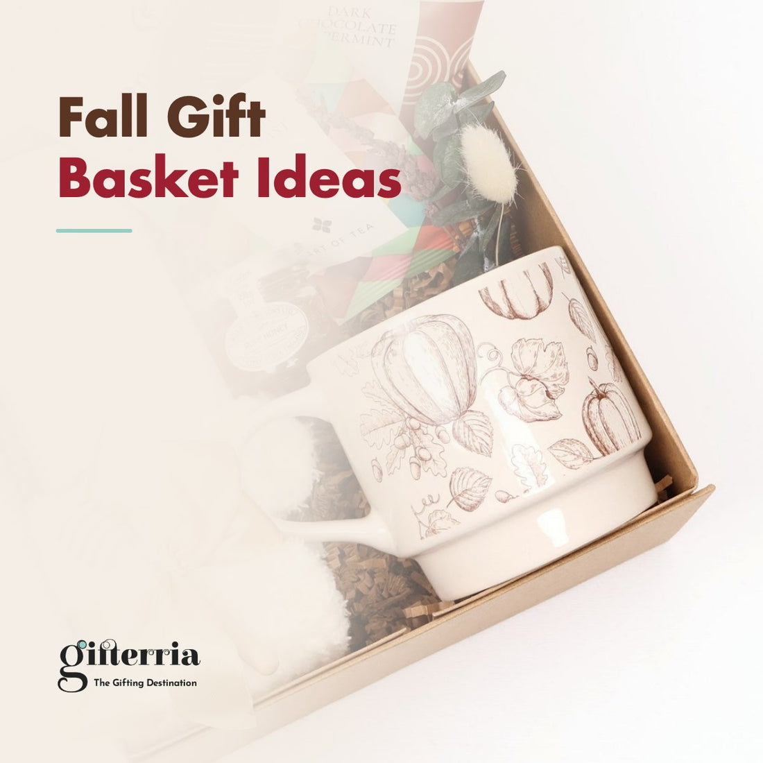 Fall gift box with a cream mug sketched with brown pumpkins, fuzzy socks and tea sachets