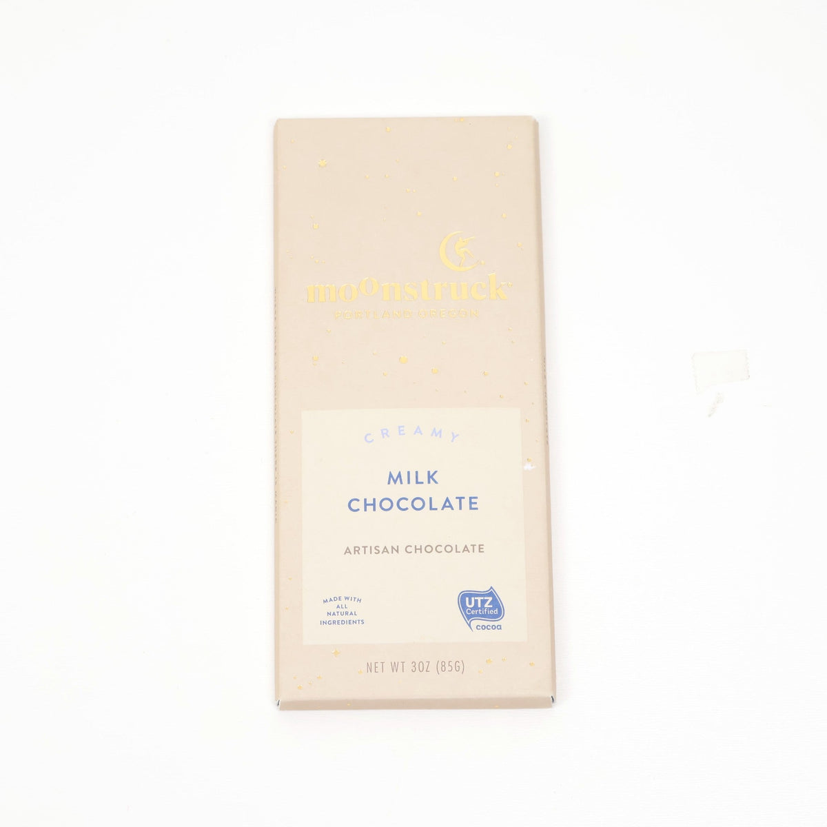 Artisan milk chocolate bar in a cream and gold wrapper
