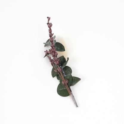 Dried floral sprig with greenery and lavender-toned buds