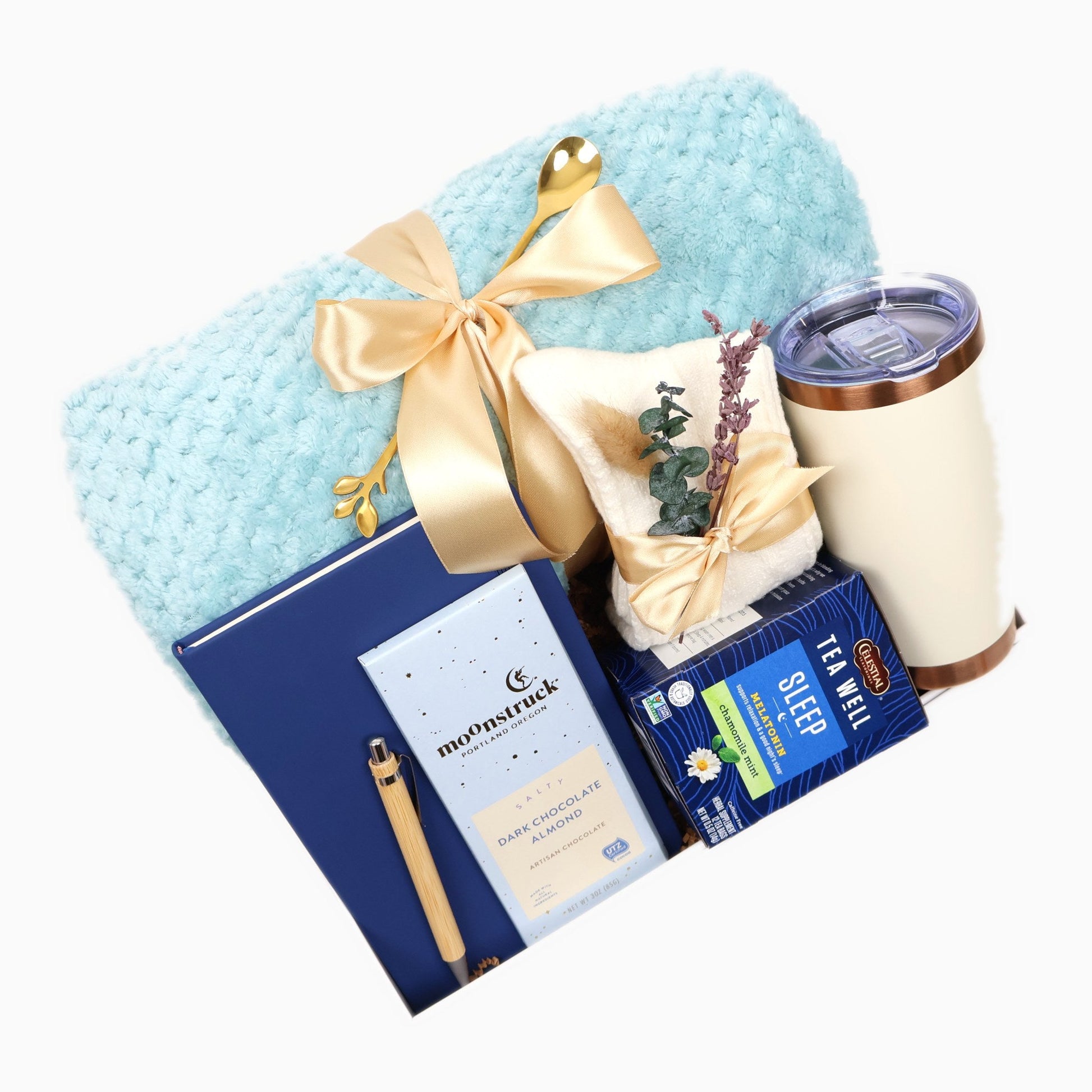 Assembled sleep and relaxation gift box, angled view with gold ribbon and dried botanicals
