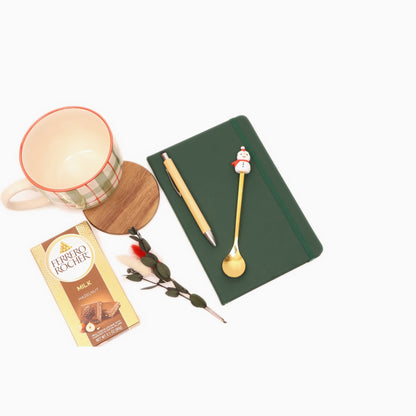 Festive Christmas Gift Box - mug, notebook and chocolate flat lay