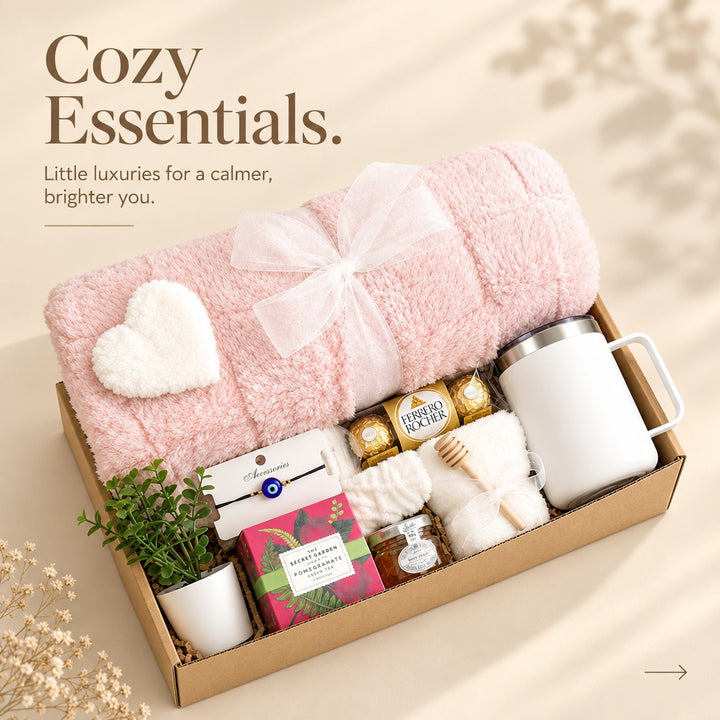 Luxury relaxation gift set with pink plush blanket, styled full box